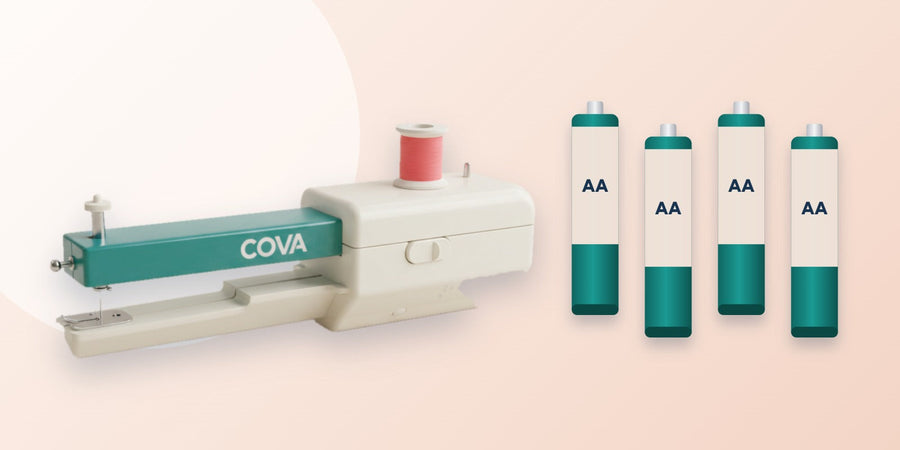 The COVA handheld sewing machine next to four AA batteries
